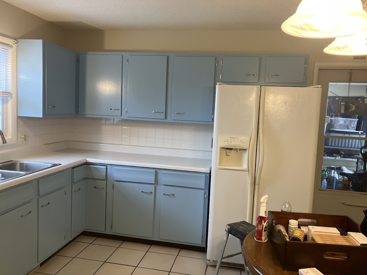 Kitchen with freshly painted blue cabinets