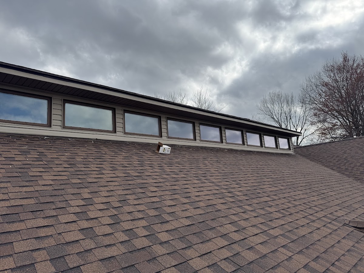 Roof with shingles and a row of clerestory windows